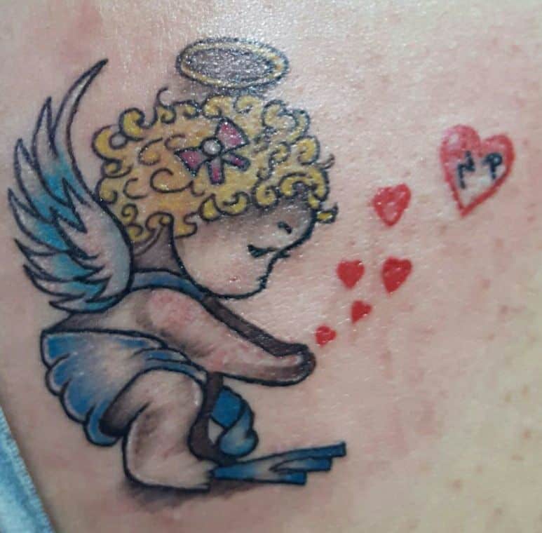 colorful babby angel tattoo gargoyle tattoo studio