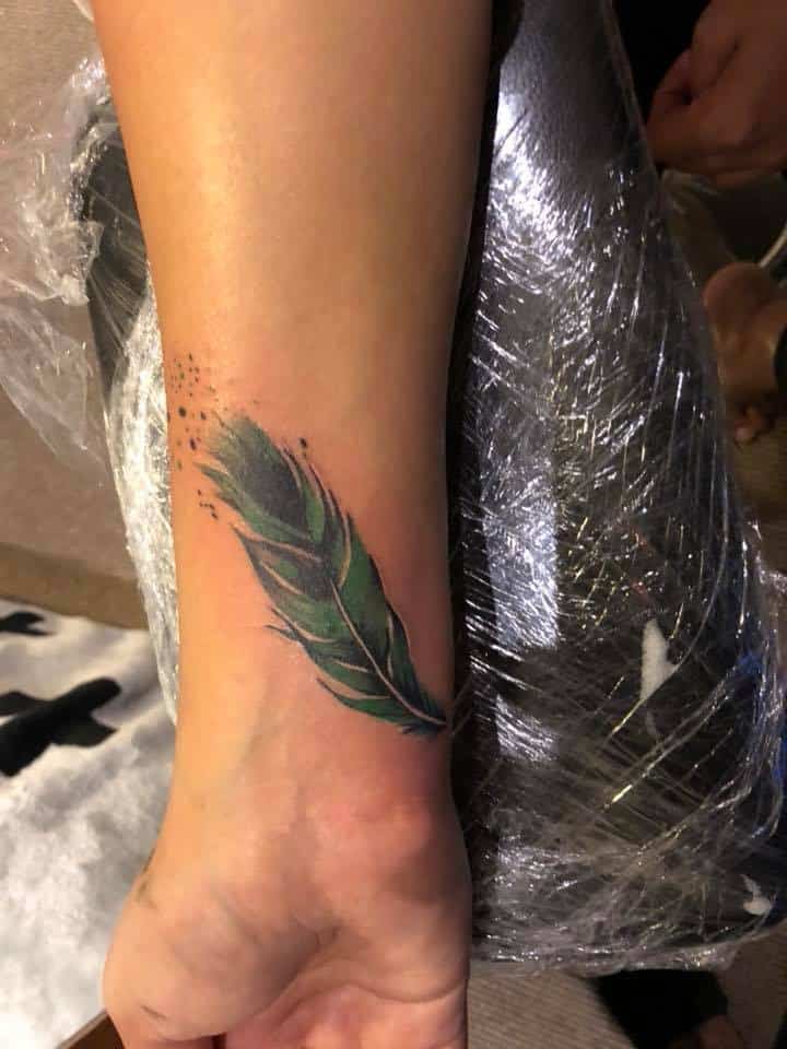 feather tattoo gargoyle tattoo studio